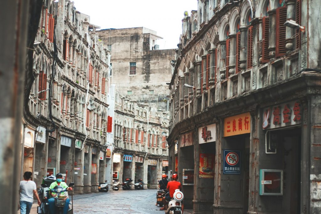 a busy street with people and buildings